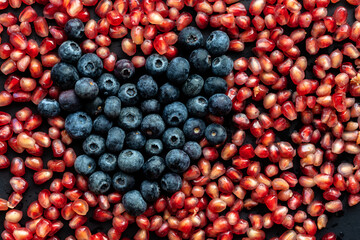 pomegranate seeds and blueberry heart