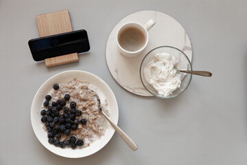 oatmeal with blueberry yogurt and coffee