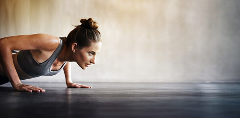 Woman, fitness and pushups on mockup for exercise, workout or intense training on floor. Sporty...