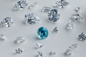 Coloured diamonds of different sizes at the workplace of a diamond expert sorting. High quality...