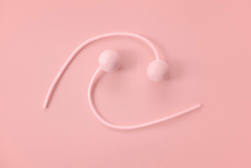 Fitness and healthy sport concept. Pink ropeless jump rope on a pastel pink background.