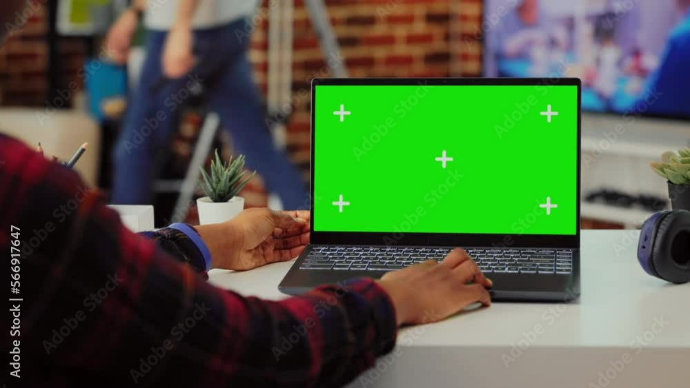 Aufkleber african american student analyzing greenscreen on laptop at desk, working with isolated display and 