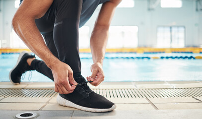 Fitness, shoes and man getting ready for training, exercise or running with sports sneakers, fashion and energy. Feet of an athlete, runner or person tying his laces for cardio or workout motivation