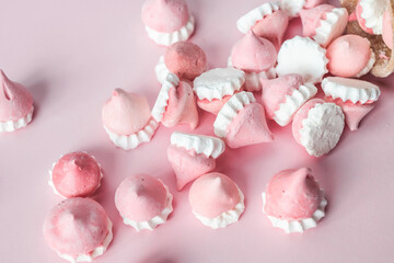 Scattered pink and white decor for baking, meringue in waffle cookies, a place for advertising