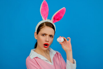 Obraz na płótnie Canvas Lipstick kiss print on easter egg. Easter bunny woman, rabbit and girl. Egg hunt.