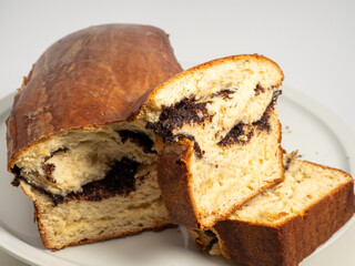 Freshly baked bread with poppy seeds. Close-up.
