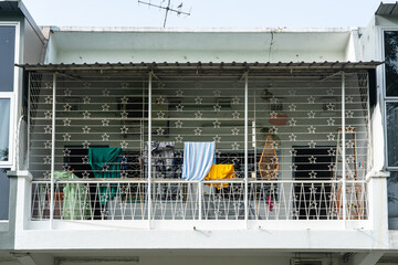 Balcony with metal grid of a old building in Singapore