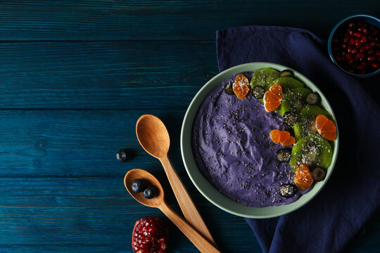 Concept of healthy food with acai smoothie, space for text