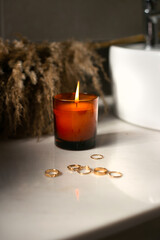 Brown Candle with the jewelry in a bathroom, add your own logo or a text, mockup file 