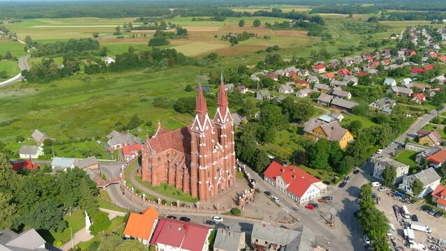 Iconic church building and countryside landscape with small town, aerial drone view