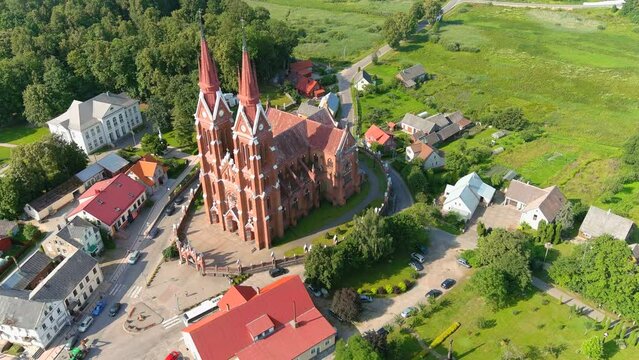 Sveksna Township and iconic red brick church with two towers, aerial view