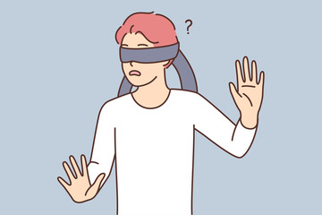 Naklejka premium Frightened teen boy blindfolded trying to grope road of action in blind
