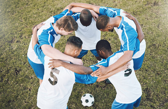 Soccer men, huddle and motivation for sports competition or game with teamwork on a field. Football group people with planning strategy, support and trust for collaboration with diversity at training