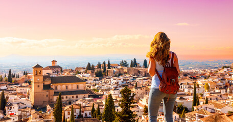 Woman traveler in Granada city panoramic view in Spain - obrazy, fototapety, plakaty