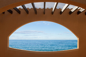 arch in the wall overlooking the sea