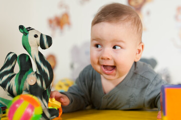Portrait view of cute amazed and surprised baby. Love and family emotion