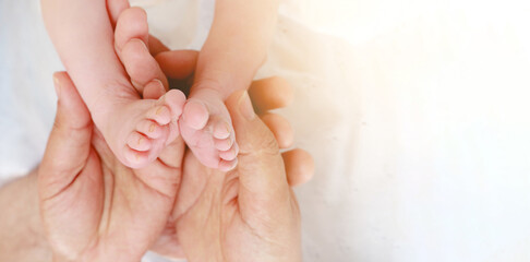 Baby feet in father's hands. My father and his child. Happy Family concept. Beautiful conceptual image of fatherhood