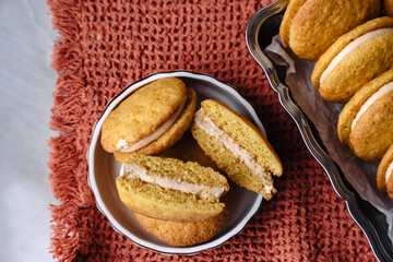 dessert cookies whoopie with cream carrot pumpkin butter cream delicious on orange background