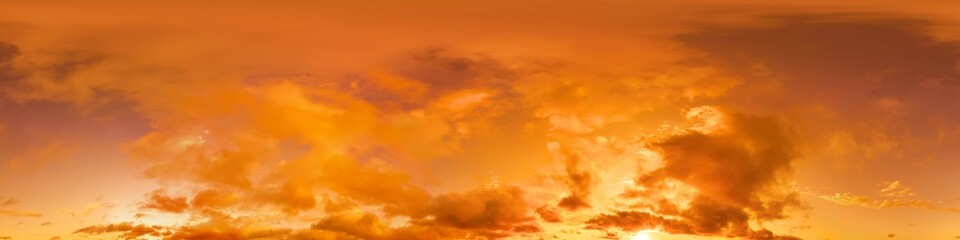 Golden glowing red orange overcast sunset sky panorama. Hdr seamless spherical equirectangular 360 panorama. Sky dome or zenith for 3D visualization and sky replacement for aerial drone 360 panoramas.