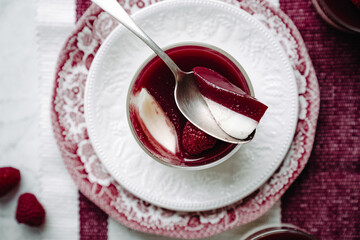 dessert with strawberries fresh mousse pannacotta berry jelly monochrome photo red and white photo sweets on english porcelain retro tableware
