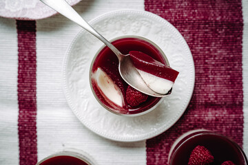 dessert with strawberries fresh mousse pannacotta berry jelly monochrome photo red and white photo...