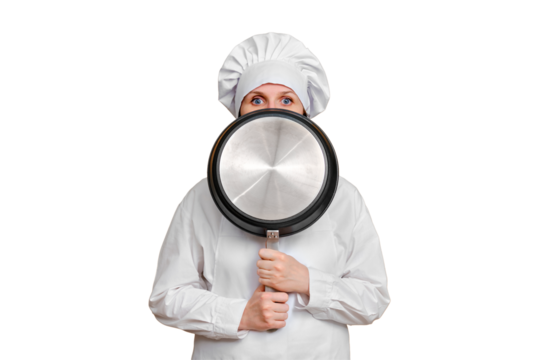 Frightened woman chef closes with a frying pan on isolated white background, copy space
