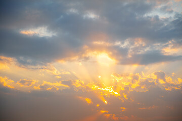 Sun shining between the clouds