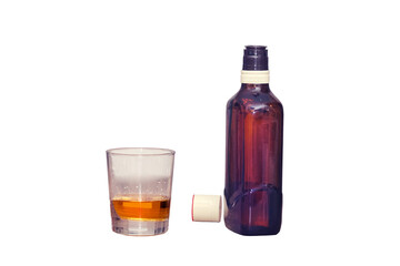 Glass with alcohol and bottle of whiskey, isolated on a white background