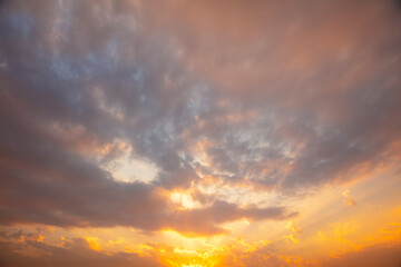 Sun shining between the clouds