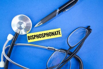 glasses, pen and stethoscope with the word bisphosphonate