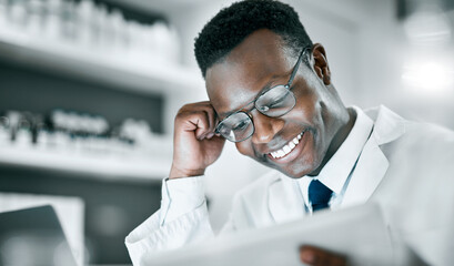 Doctor, black man and tablet in lab for research, medical knowledge or happy for success,...