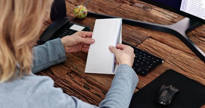 Paycheck In Open Envelope