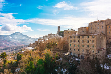 Fototapeta premium Snow in Tuscany, Castelnuovo Val di Cecina village, winter panorama. Pisa, Italy