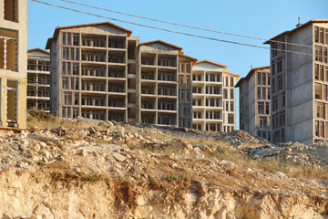 Building facades under construction. Work in progress. Development and investment