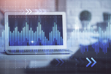 Financial market graph hologram and personal computer on background. Double exposure. Concept of forex.