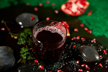 Glass of pomegranate juice and fresh fruits