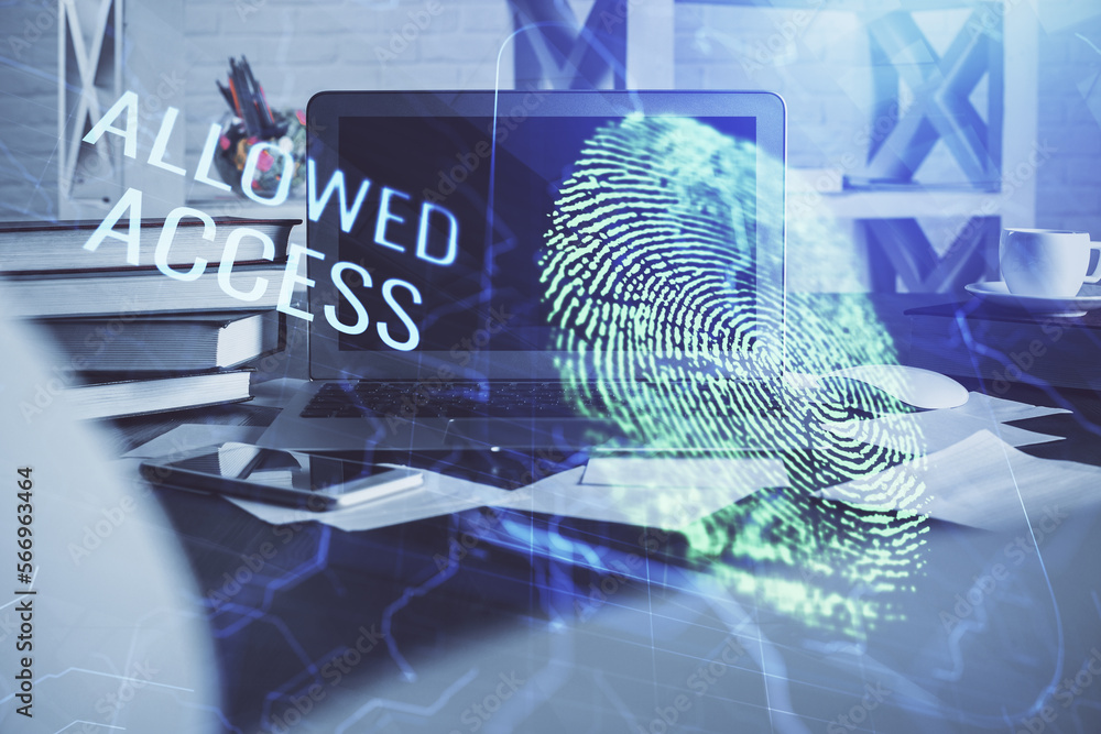 Poster Computer on desktop in office with finger print drawing. Double exposure. Concept of business data security.