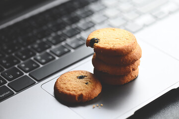 internet cookies, mini cookies on keyboard computer laptop for internet browser cookies concept - 566963839