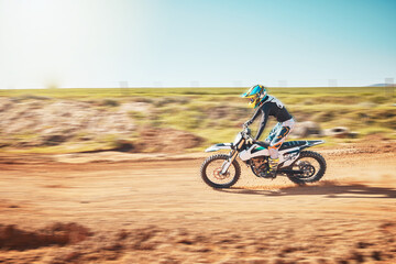 Fototapeta premium Motorbike, motorcross and speed on sand trail with power, sunshine and sports rally. Driver, motorcycle and man travel on dirt track, adventure course and action for freedom, performance and talent
