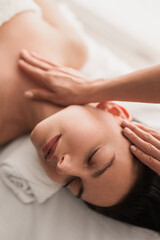 Relaxed woman at spa therapy