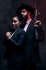 Gangster couple, fashion or gun on studio background in secret spy, isolated mafia safety or crime...