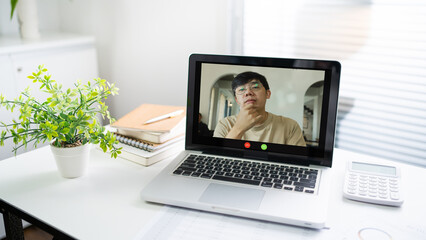 Fototapeta premium Laptop with Mock up blank screen on wooden table in front of cafe space for text. product display computer laptop montage- technology Freelance work concept