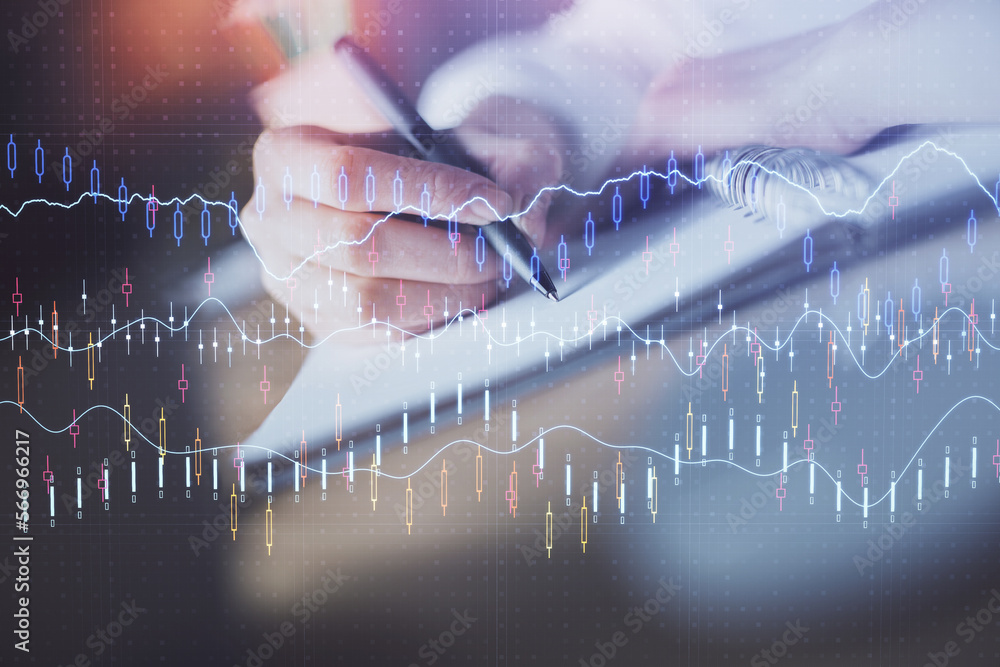 Poster financial forex graph displayed on hands taking notes background. concept of research. double exposu