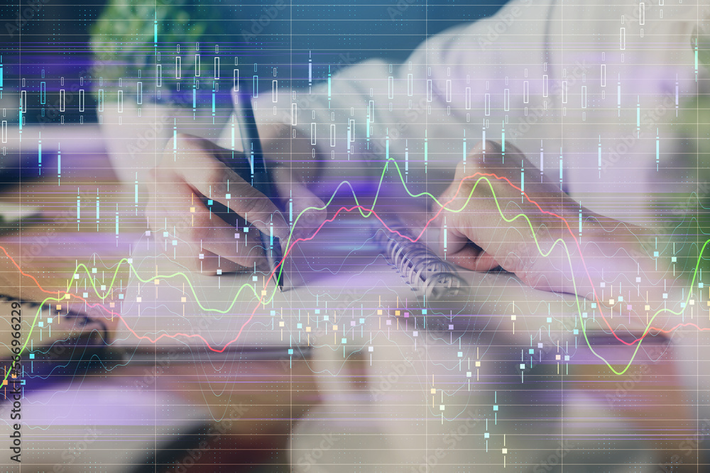 Poster financial forex graph displayed on hands taking notes background. concept of research. double exposu