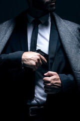 Bodyguard, hands or gun in suit jacket on studio background in dark secret spy or isolated mafia...