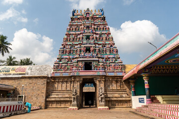 The tall gopuram entrance tower of an ancient Hindu temple around the town of Kumbakonam in Tamil...