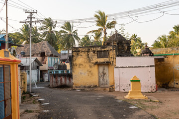 A street lined with old rustic traditional architecture of temples and houses in the village of Tiruvaiyaru.