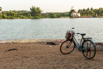 A bicycle parked on the banks of the Cauvery river in the village of Thirvaiyaaru.