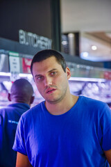 man in front of butchery section