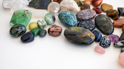 Gemstones background image. Chakra healing stones and crystals. Turquoise, amethyst, quartz, agate...